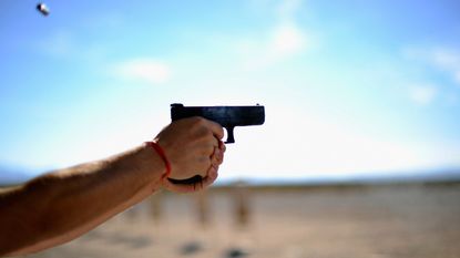 A pistol is fired at a US gun show