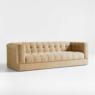 A velvet tufted sofa