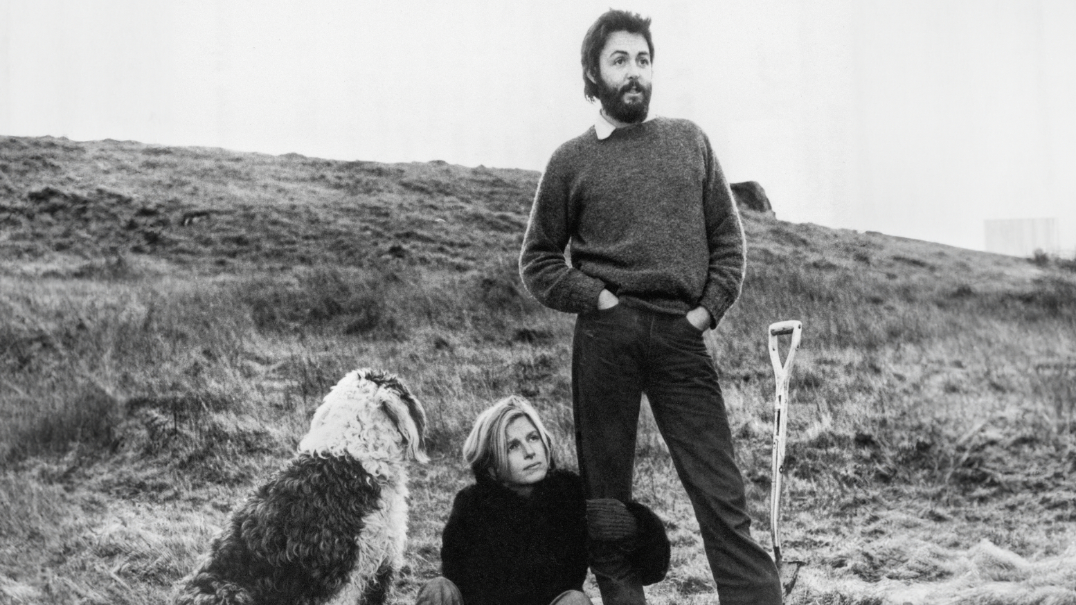Paul and Linda McCartney, plus dog, on their farm, black and white photo