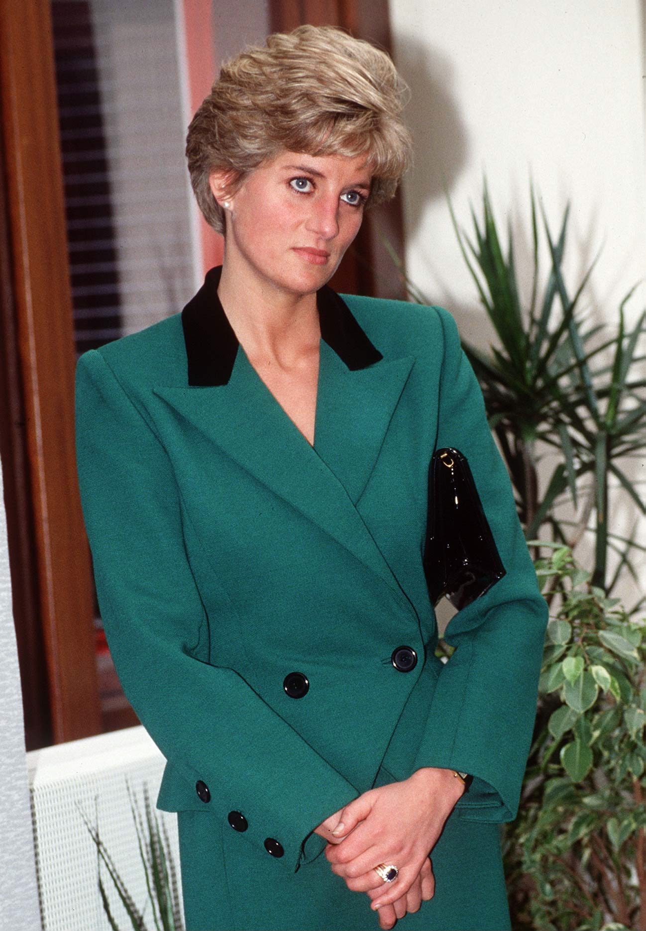 Princess Diana wearing a green suit