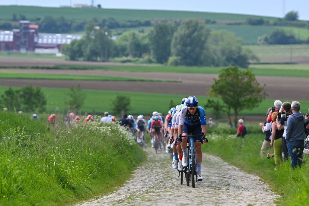 PONTMARCQ FRANCE MAY 17 Riley Sheehan of The United States and Team Israel Premier Tech competes passing through a cobblestones sector during the 68th 4 Jours de Dunkerque Grand Prix des Hauts de France 2024 Stage 4 a 1668km stage from Mazingarbe to PontMarcq on May 17 2024 in PontMarcq France Photo by Luc ClaessenGetty Images