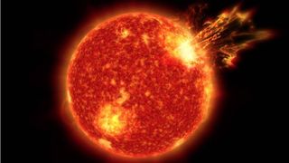An image of the sun with a massive solar flare ejecting from its surface.