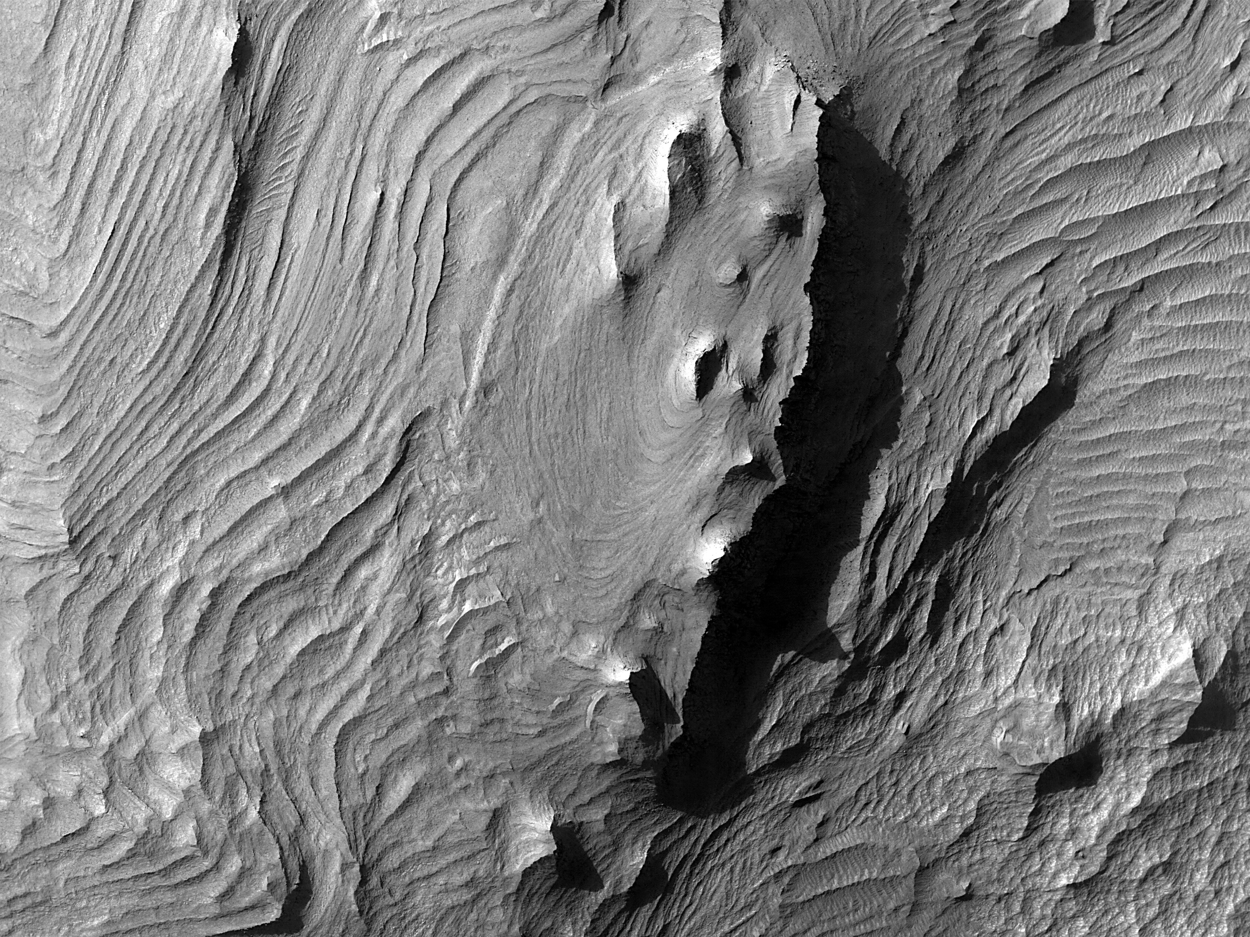 The folded layers of eastern Candor Chasma on Mars.