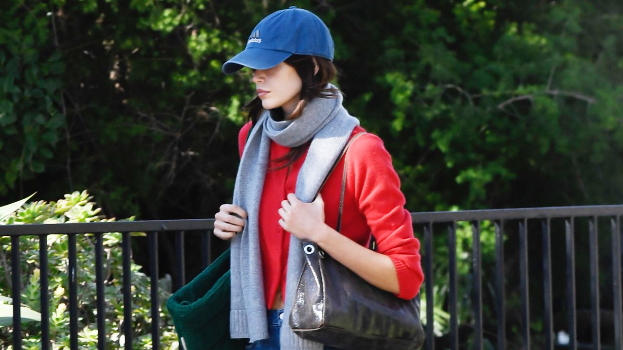 Kaia Gerber wearing barrel jeans and soccer cleat sneakers