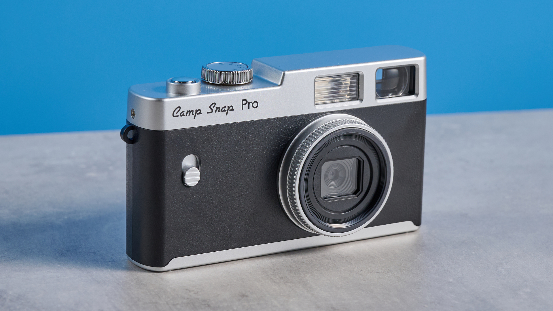 Camp Snap CS-Pro in black and silver photographed on a blue background