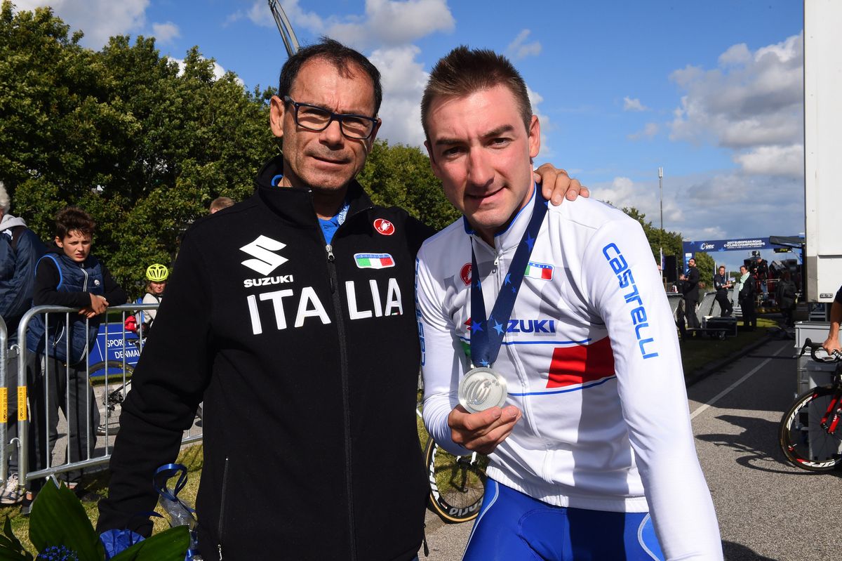Italian national coach Davide Cassani with Elia Viviani post-race