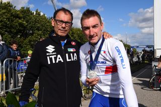 Italian national coach Davide Cassani with Elia Viviani post-race