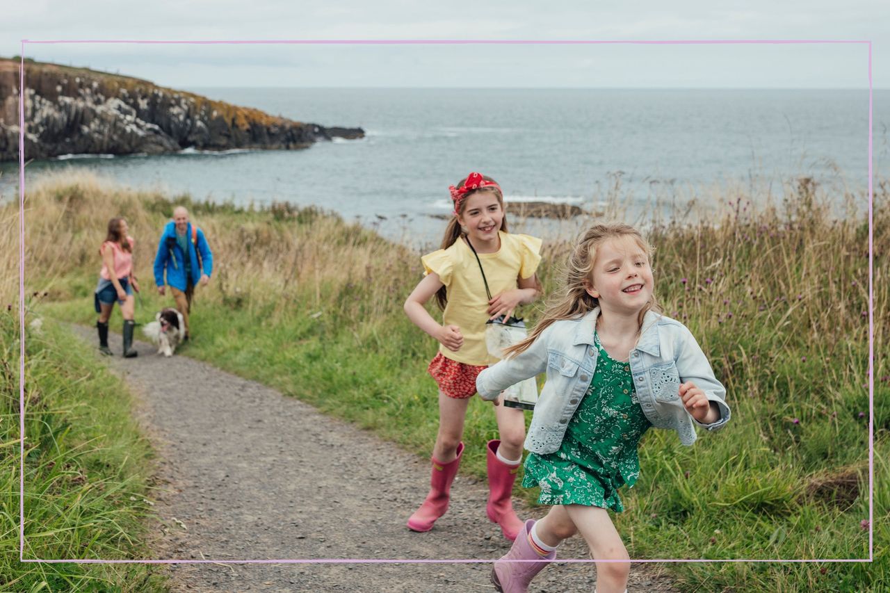 Children on a dog walk with their parents