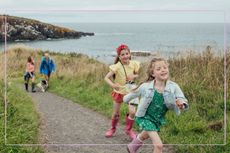 Children on a dog walk with their parents