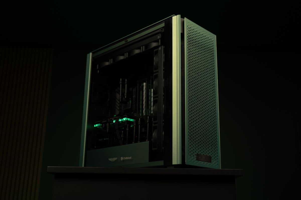 A PC gaming rig designed by Aston Martin, green with wood pannelling