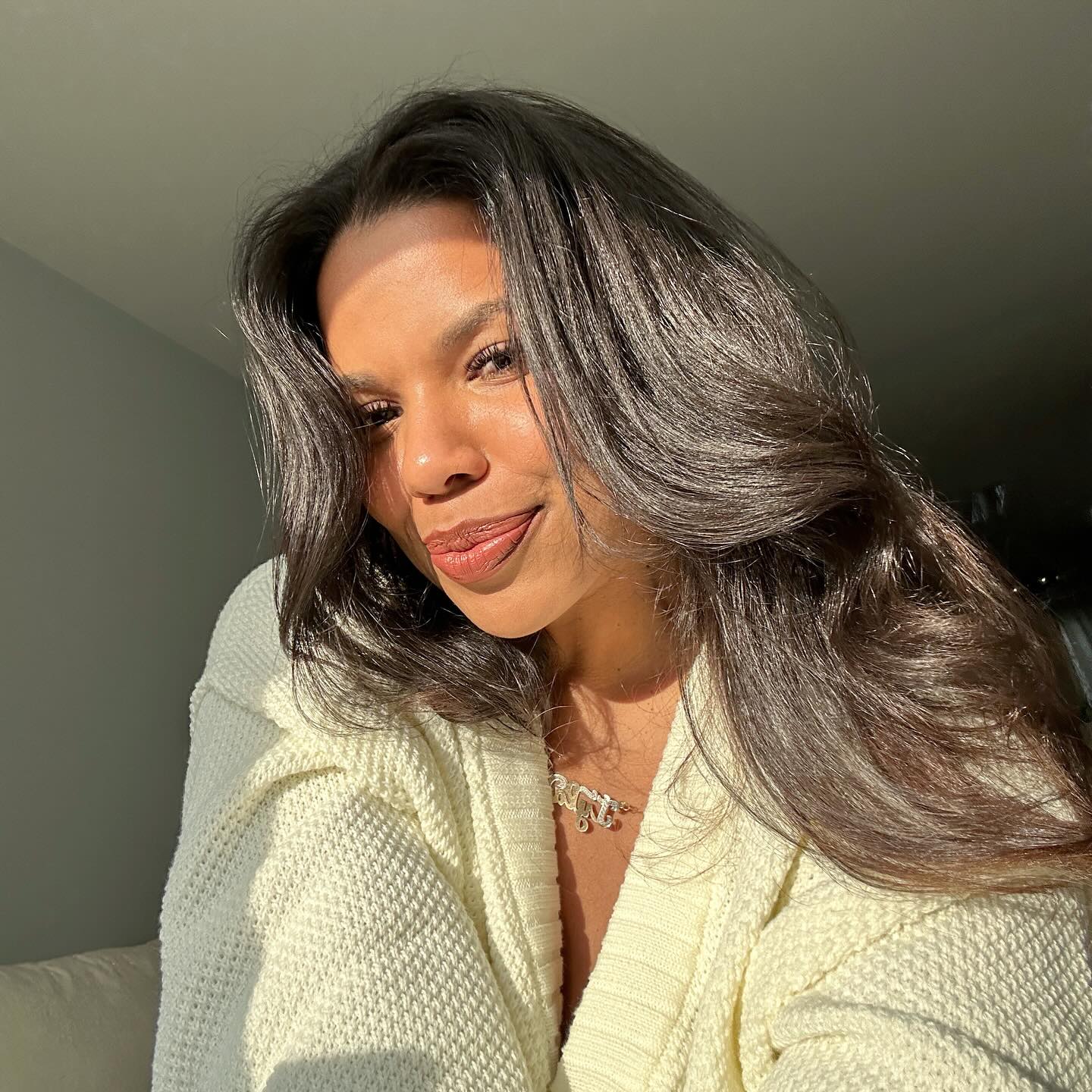 Woman with shiny hair in sunlight.