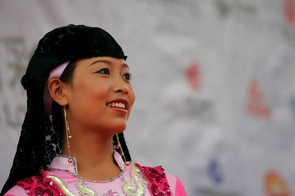 One of the podium girls in traditional costume.