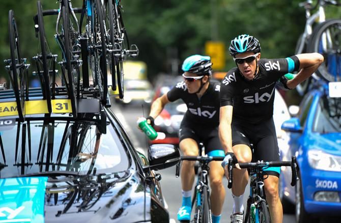 Team Sky Procycling Mathew Hayman and Ben Swift collect water bottles at the back of the race.