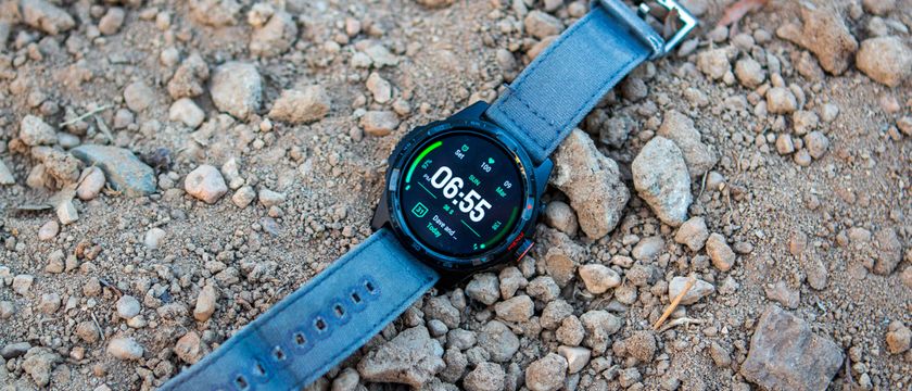 TicWatch Atlas sitting in dirt and rocks - 21x9