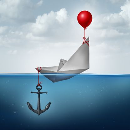 paper boat on sea with a red balloon tied to the bow and an anchor tied to the stern