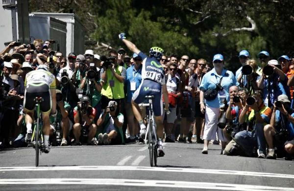 Alejandro Valverde (Movistar) and Simon Gerrans (GreenEdge) cross the line at Old Willunga Hill.