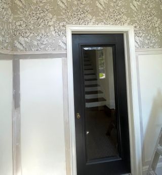 DIY board and batten wall being painted using grey paint wall decor