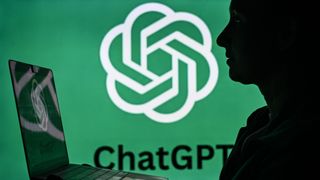 An image of a woman holding a laptop in front of a ChatGPT logo displayed on a computer screen.