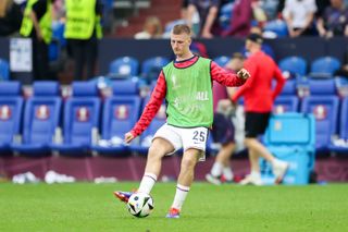 England midfielder Adam Wharton warms up at Euro 2024