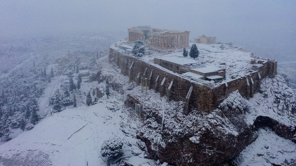 The rare snow covers the Acropolis of Athens in a stunning white mantle