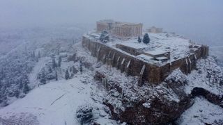 The ancient Acropolis in Athens was covered in white during a rare snowfall on Feb. 16, 2021.