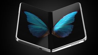A concept image of a folding phone with a picture of a butterfly's wings spread across the two halves of the screen