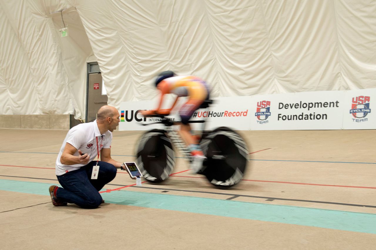 Evelyn Stevens is fed information from her coach during the ride