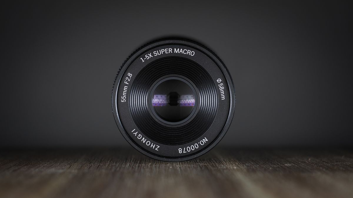 Mitakon 55mm f/2.8 1-5x Macro on a wooden surface