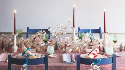 Christmas table setting with red, blue and white theme
