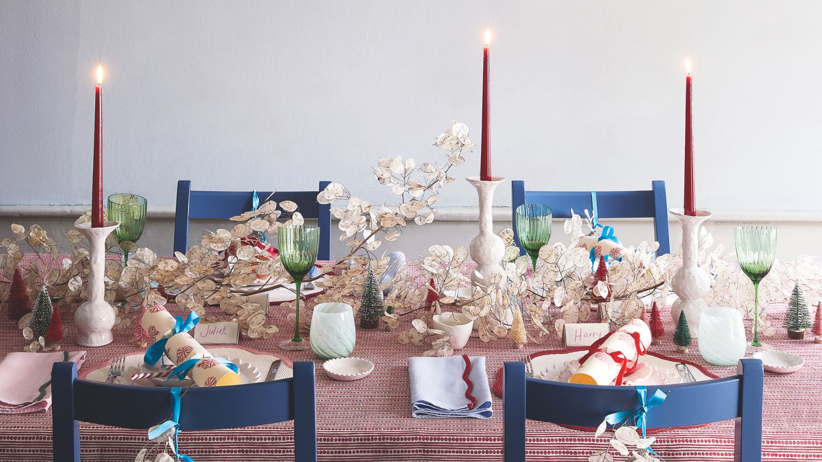 Christmas table setting with red, blue and white theme