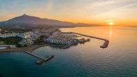 The famous Puerto Jos&eacute; Banus harbour in sunrise, a marina located in the area of Nueva Andaluc&iacute;a, to the southwest of Marbella known for luxury shops, its calm, shallow water & fine sand beach.