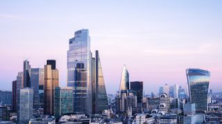 Panoramic shot of the London financial services district at dusk.