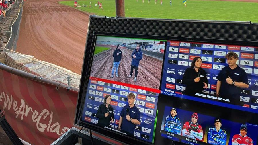 A view out the window at a UK motorcycle track with LiveU streaming monitors in the foreground. 