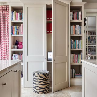 white cupboard with book shelf