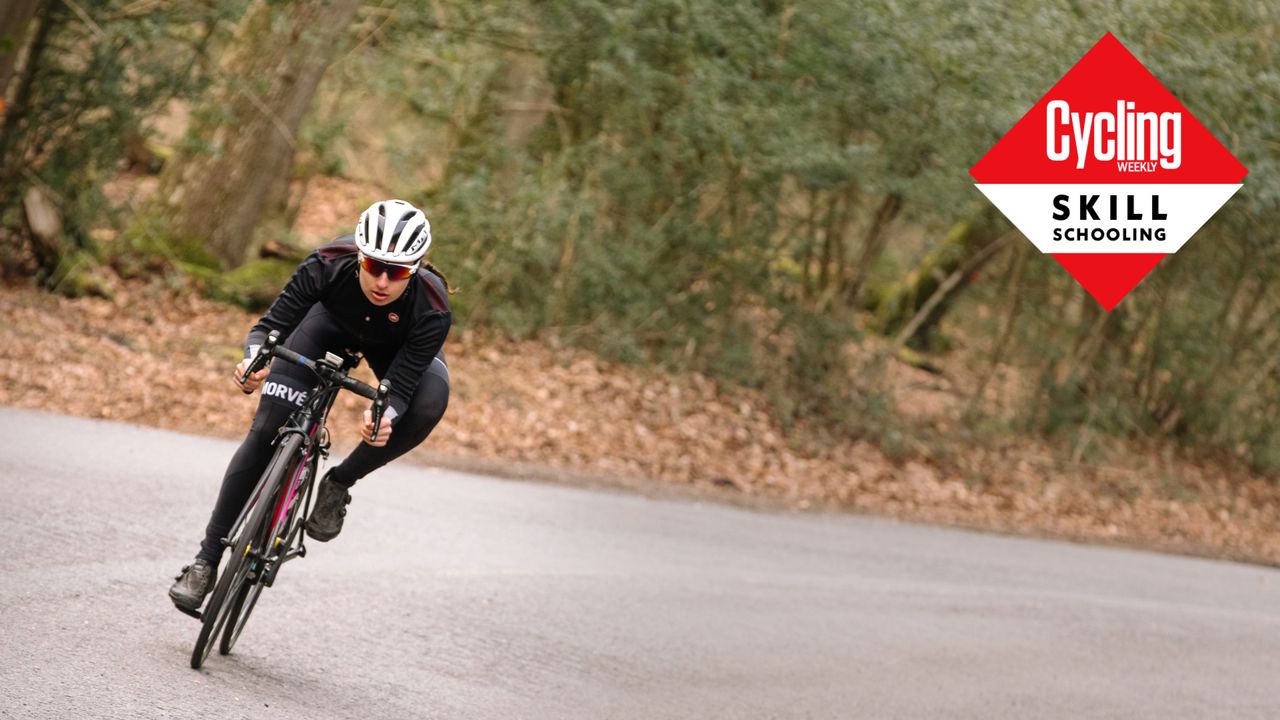 Image shows a rider cornering on a road bike.