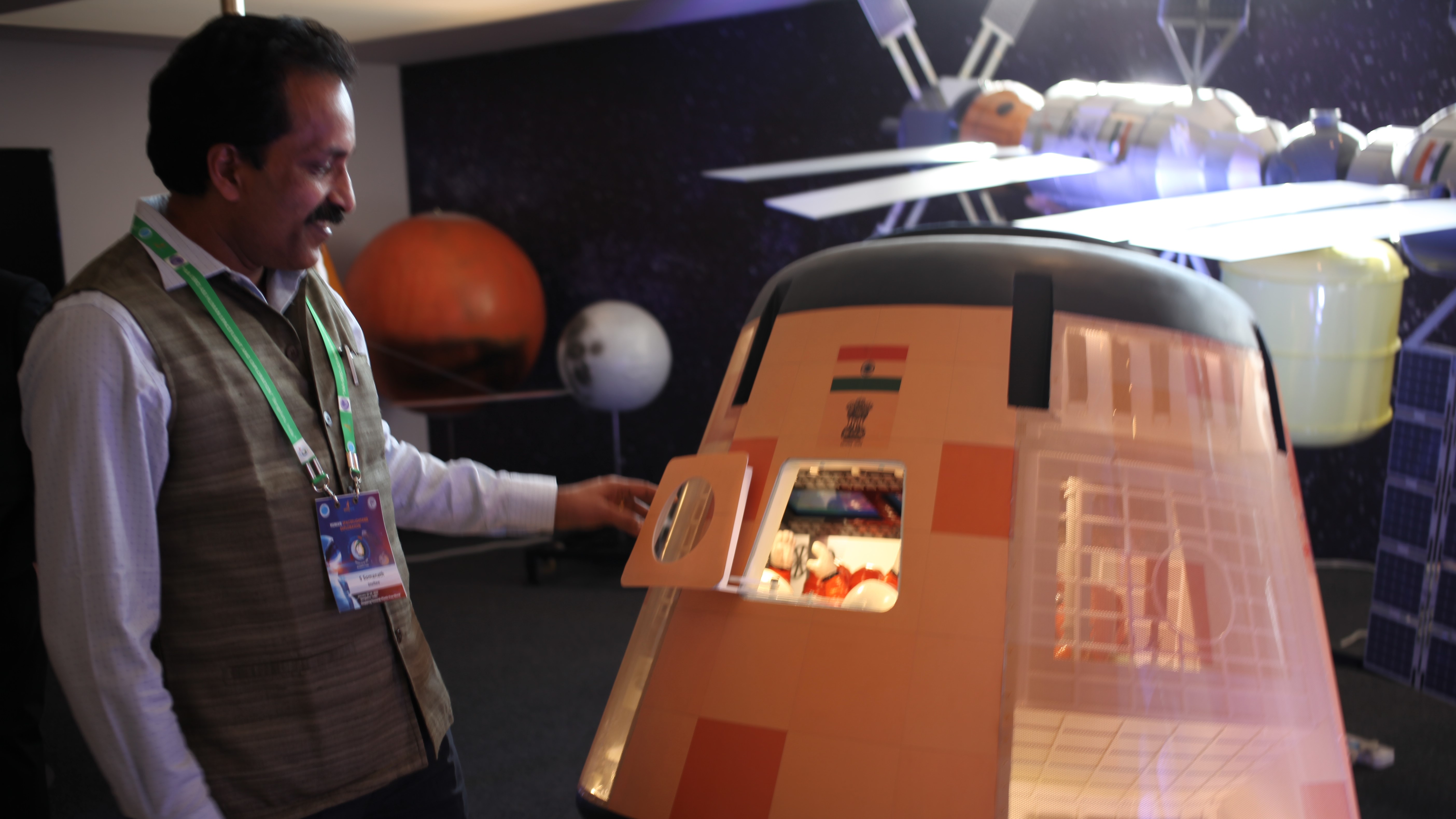 S. Somanath, then director of the Vikram Sarabhai Space Center, stands next to a scale model of India's Gaganyaan crew module in 2020.