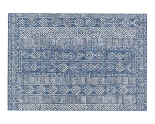 A blue and white patterned outdoor rug from Raymour & Flanigan