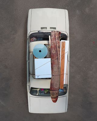 Birds eye view of car with luggage on roof