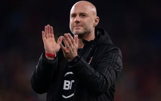 Wales manager Rob Page applauds the fans