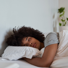 botox helps you sleep: woman sleeping in her bed in the morning