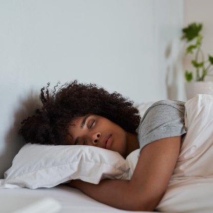 botox helps you sleep: woman sleeping in her bed in the morning