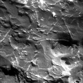 Photo of the Mars meteorite showing triangular ridges thought to be a characteristic of iron-nickel. The picture was taken by Mars Rover, Opportunity.