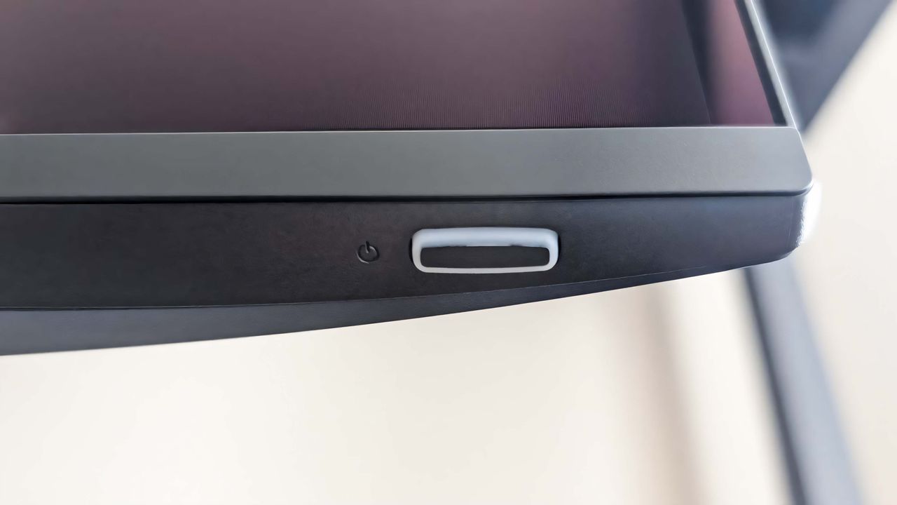 A closeup of the Alienware 34 Curved QD-OLED AW3425DW's power button.