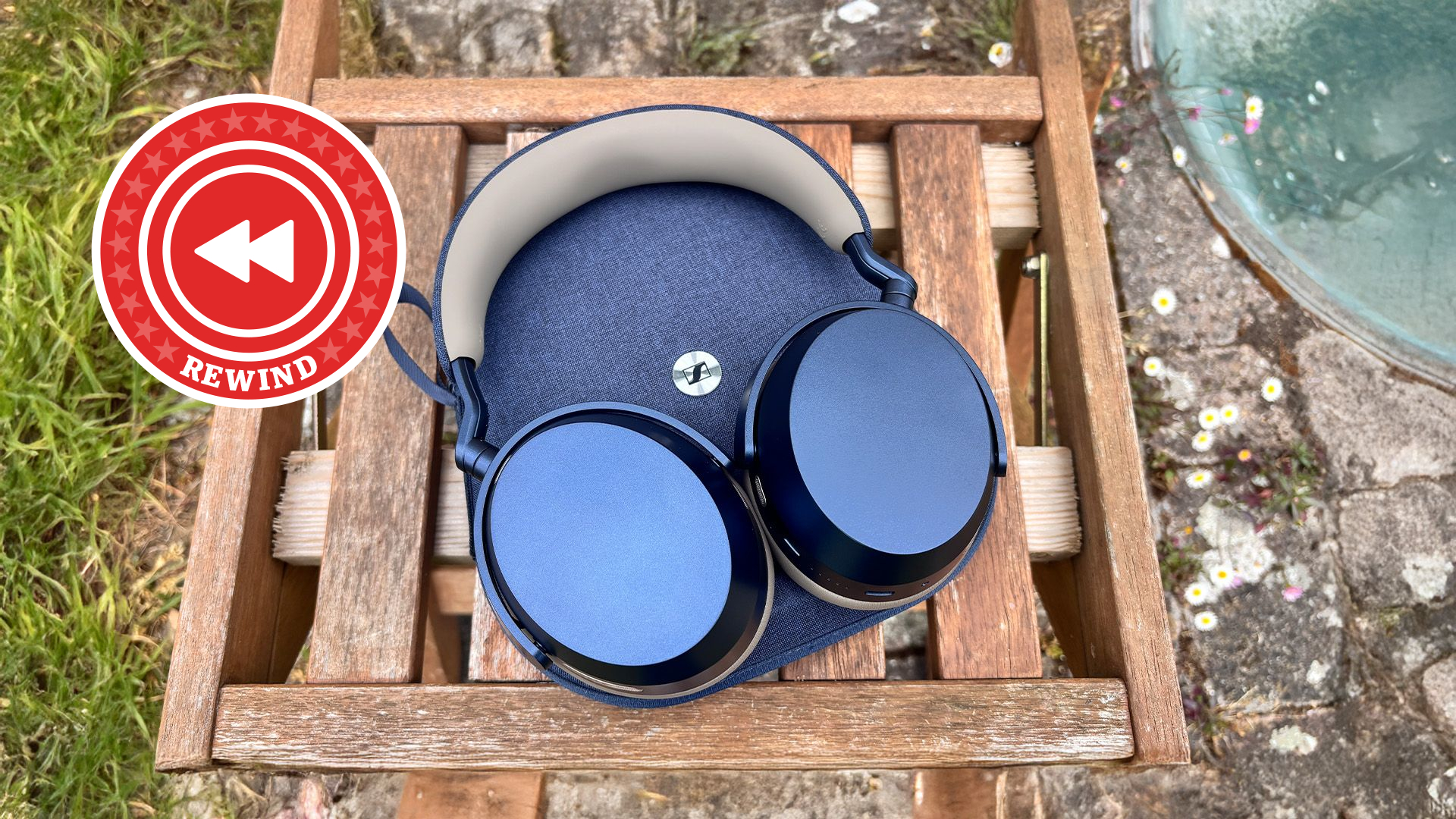 Sennheiser Momentum 5 on table with Rewind logo