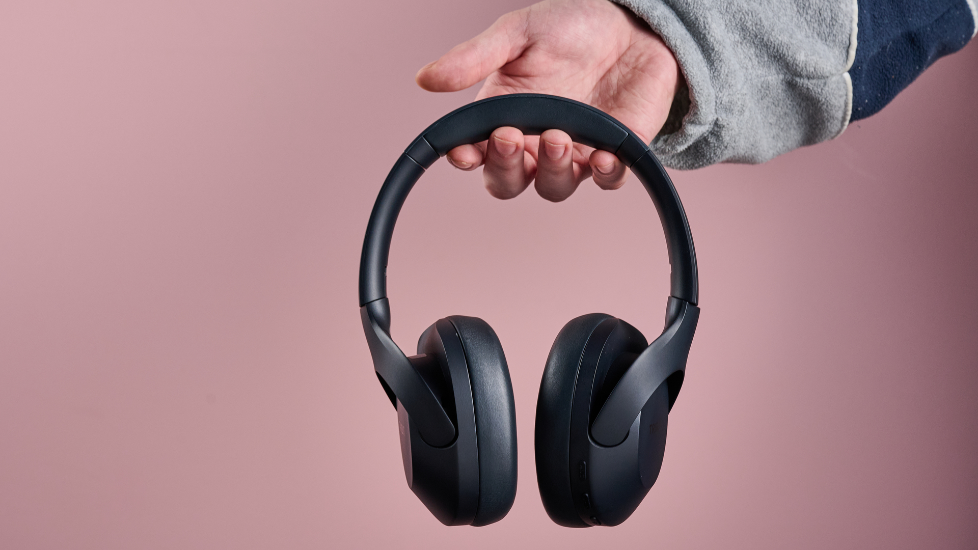 Man holding the Tribit QuietPlus 81