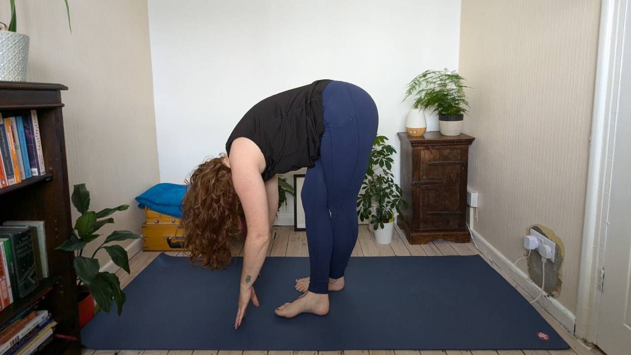 Standing forward bend yoga pose