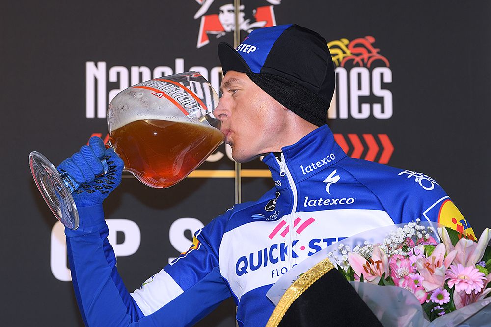 Niki Terpstra takes a drink of a well-derserved winner's beer at Le Samyn