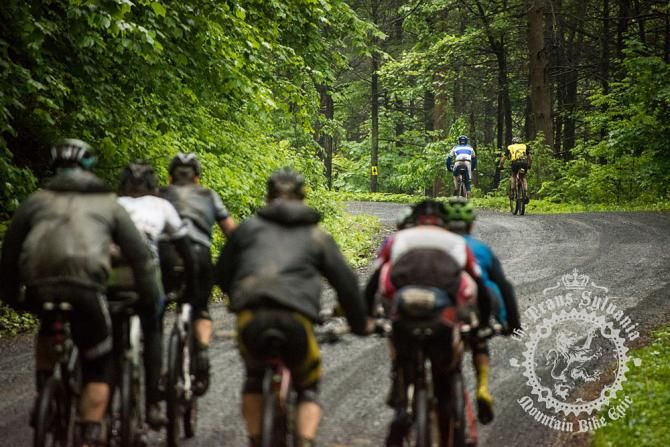 Dax Massey and Kevin Maldonado ahead of the peloton of riders on the gravel roads of stage 3.