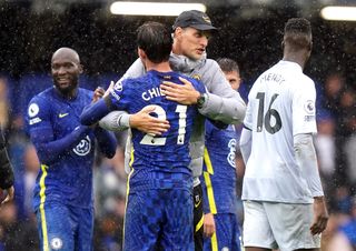 Chelsea manager Thomas Tuchel celebrates with Ben Chilwell after the final whistle during the Premier League match at Stamford Bridge, London. Picture date: Saturday October 2, 2021