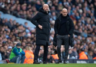 Manchester United Manager Erik ten Hag and Manchester City Manager Pep Guardiola look on during the Premier League match between Manchester City and Manchester United at Etihad Stadium on March 3, 2024 in Manchester, England. (Photo by Joe Prior/Visionhaus via Getty Images)